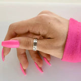 bague pouce argentée et ajourée
