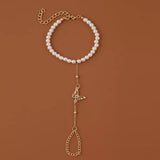 bracelet bague perlé doré avec pendentif papillon