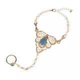 bracelet bague or et pierre de couleur bleu