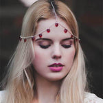 Head jewelry with red pearls and gold-colored leaves