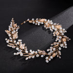Head jewelry with white pearls and gold-colored leaves