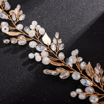 Head jewelry with white pearls and gold-colored leaves