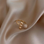 bague pouce strass et trio de boules